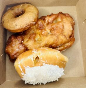 Blueberry Cake Donut, Peach Fritter, Coconut Cream Filled Donut
